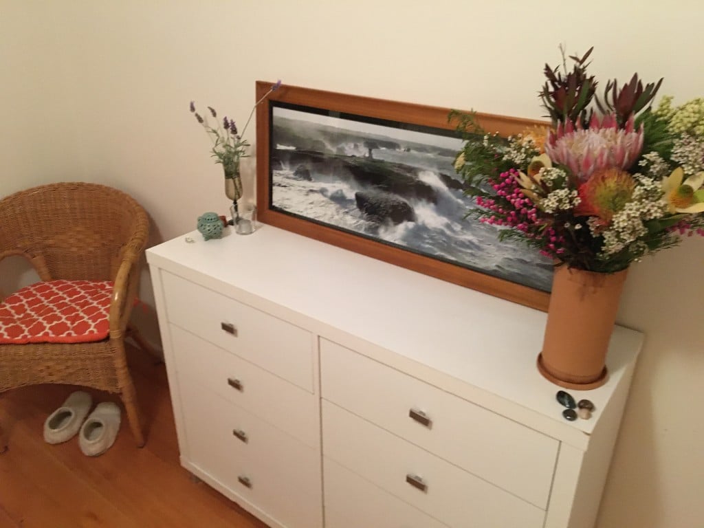 white chest of drawers with picture and flowers on it What makes a place feel like home Generative Change Life Changing Coaching Online and by Phone