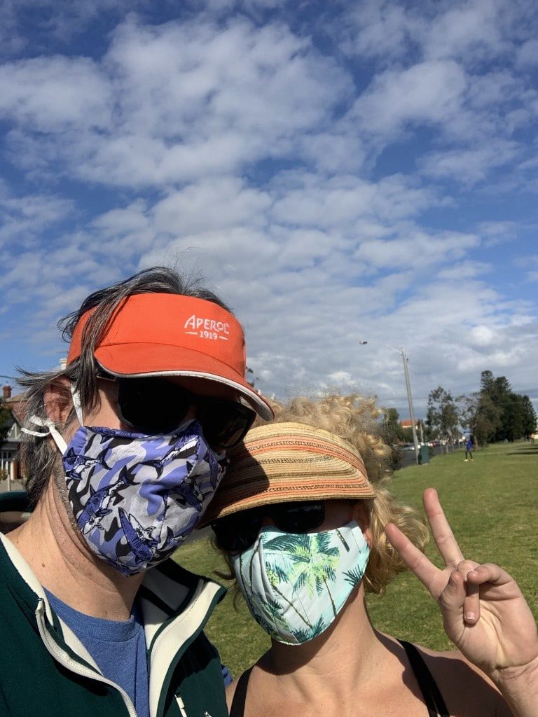 Two people with masks on living in Melbourne right now Generative Change